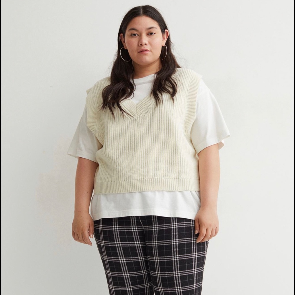 Double-knit sweater vest with a V-neck and ribbing at neckline,armholes and hem.